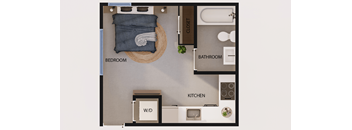 A floor plan of a small apartment with a bedroom, bathroom, kitchen, and a workspace.