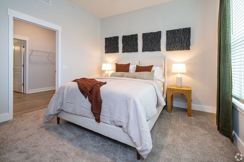 a bedroom with a bed and a closet