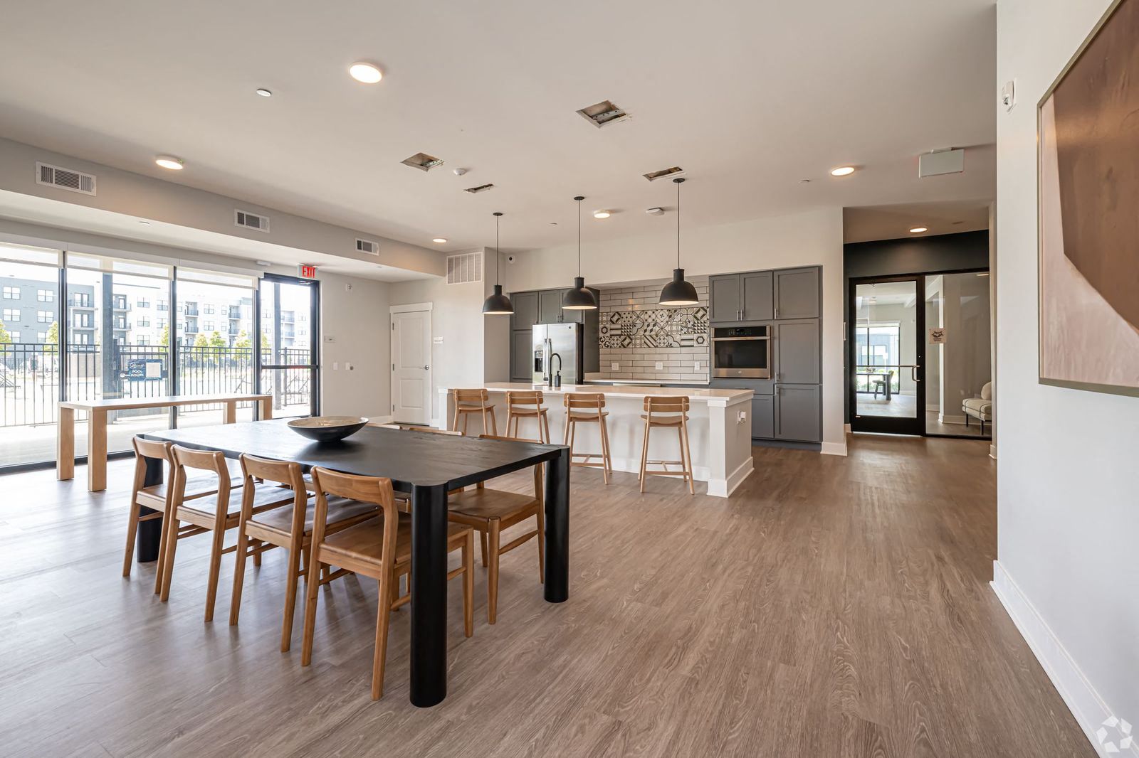 a kitchen and dining room with a table and chairs