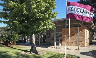 a building with a flag in front of it