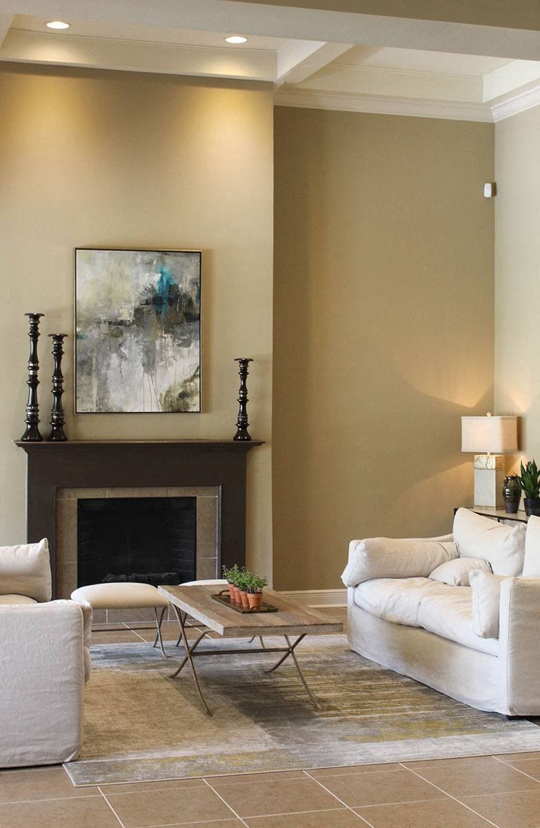 a living room with a white couch and a fireplace