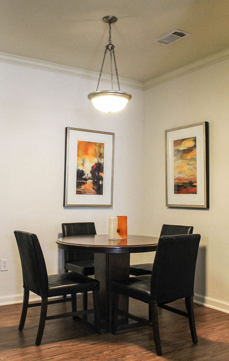 a dining room with a table and chairs