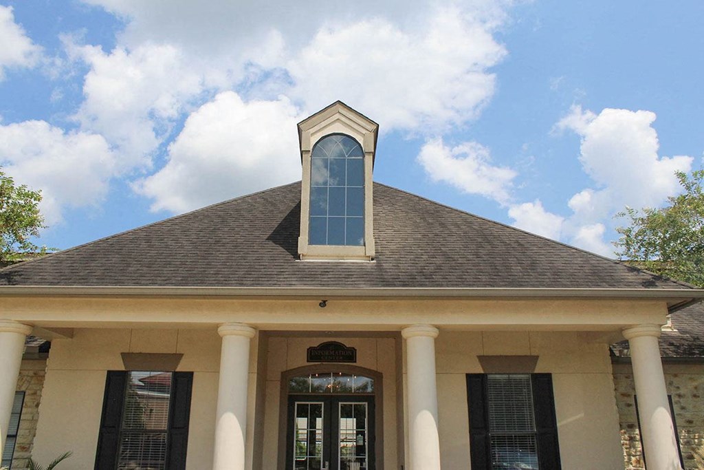 the roof of a house with a large window