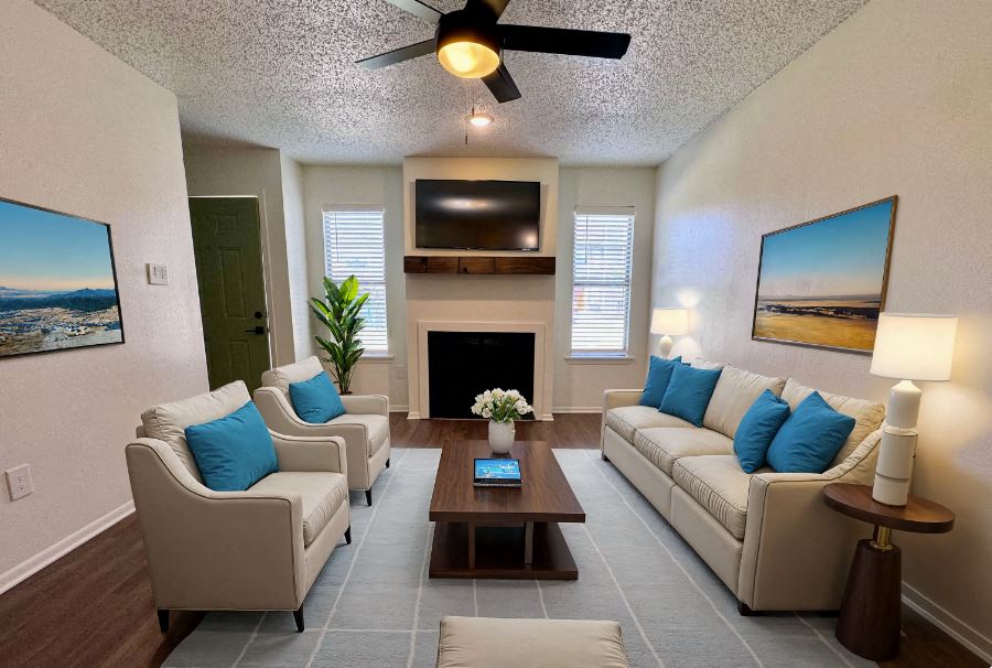 a living room with couches and a coffee table