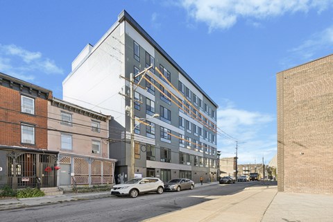 a large apartment building on a city street at The Commons On Ludlow Apartments, Philadelphia, 19104