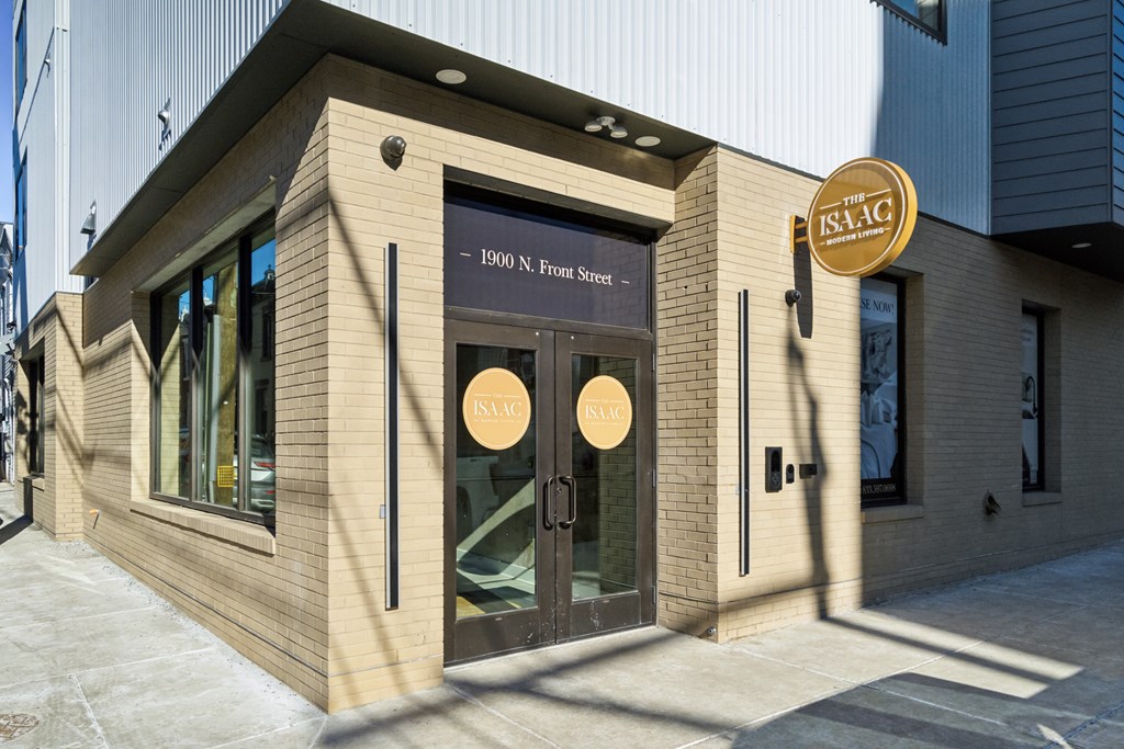 The front of a building with a sign that reads "ISAAC" and "1900 N. Fulton St."