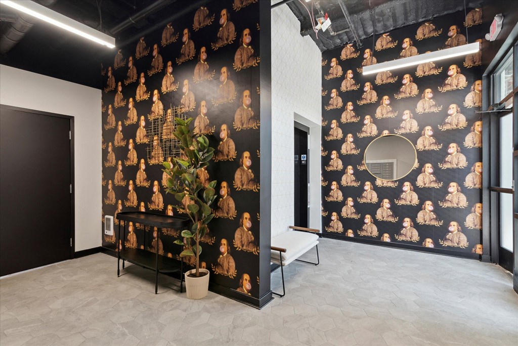 an image of a room with a large mural of people on the wall