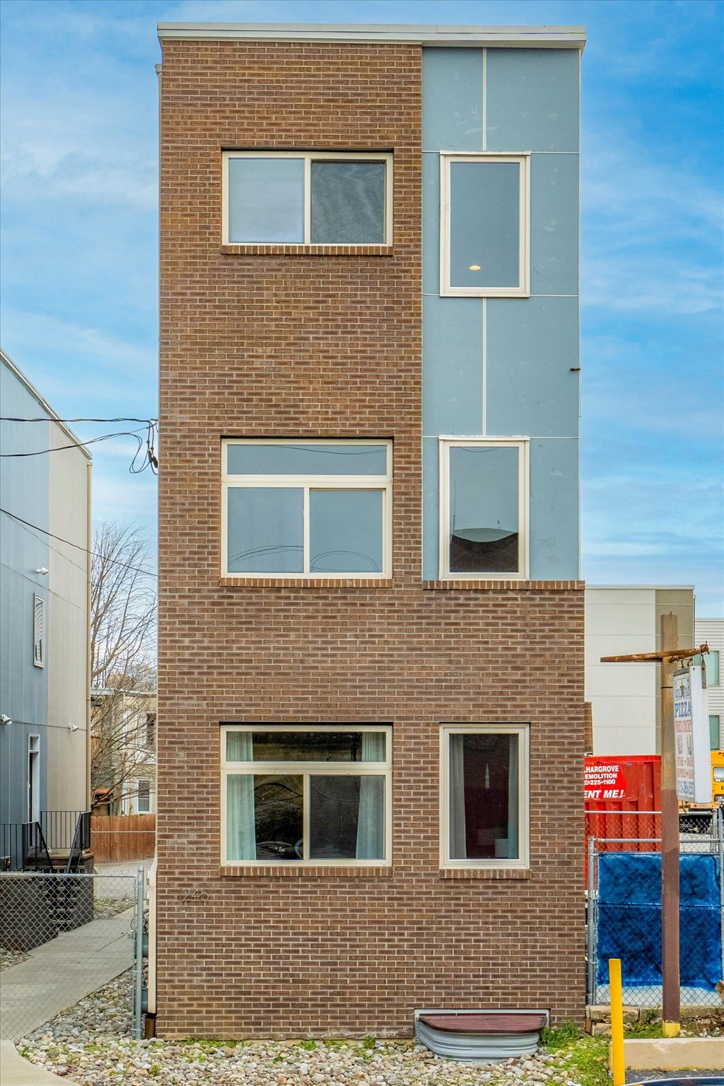 the front of a brick building with windows