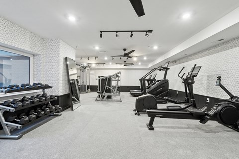 A spacious gym with a variety of equipment at The Isaac Apartments, Philadelphia, PA 19122