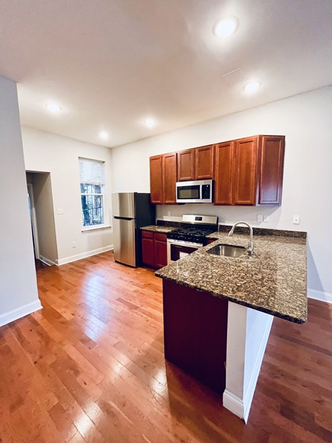 a kitchen with a granite counter top and