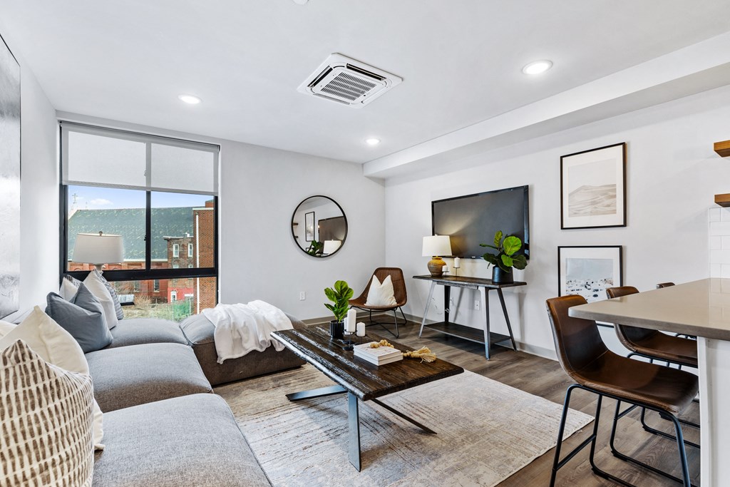 an apartment living room with a couch and a table