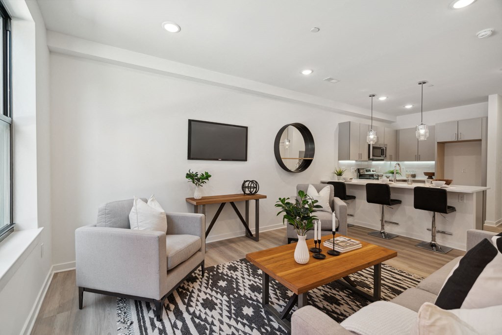 Living room with white walls and hardwood flooring  at The Anchorage on Kelly, East Falls, 19129