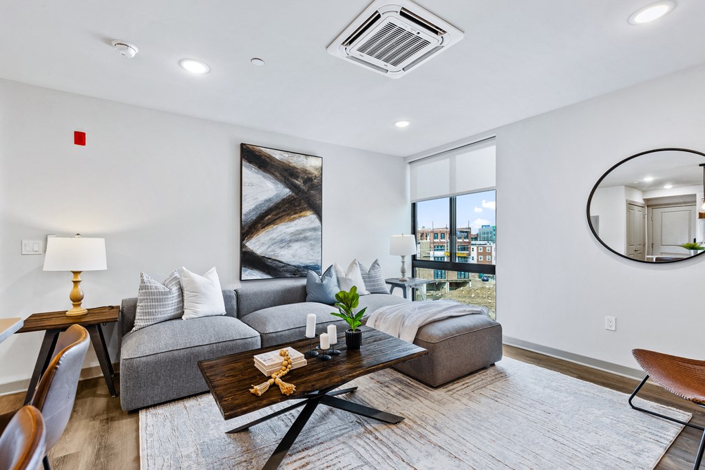 an open living room with a couch and a coffee table