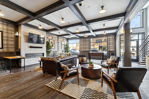A modern living room with a fireplace and a flat screen TV.