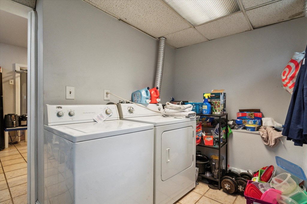 the laundry room has a washer and dryer in it