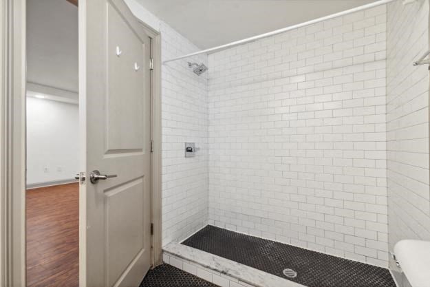 a bathroom with a shower and a sink