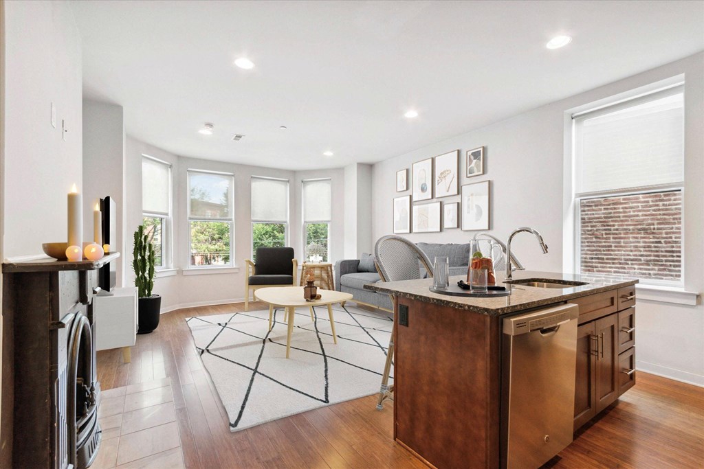 a living room with a kitchen and a dining room