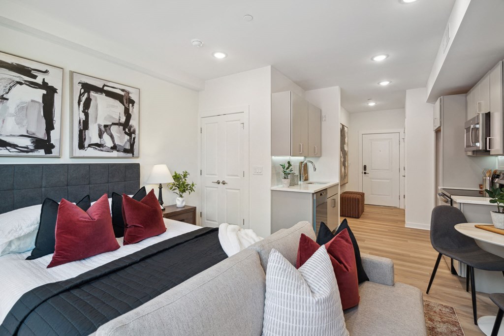 Bedroom with a bed and a couch in a room with a kitchen  at The Anchorage on Kelly, Philadelphia, Pennsylvania