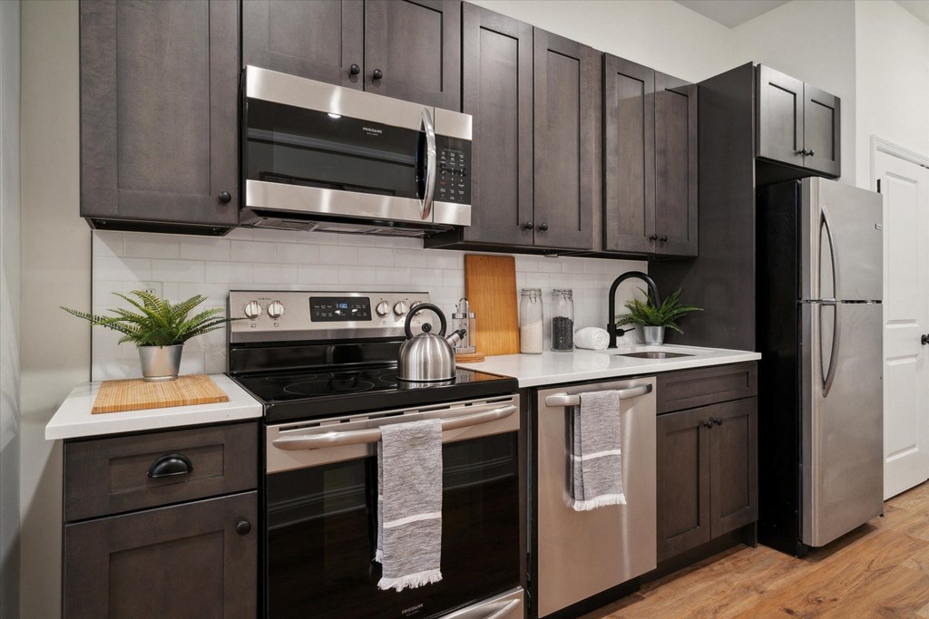 a kitchen with a stove and a sink