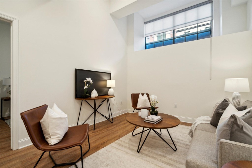 a living room with a couch and two chairs