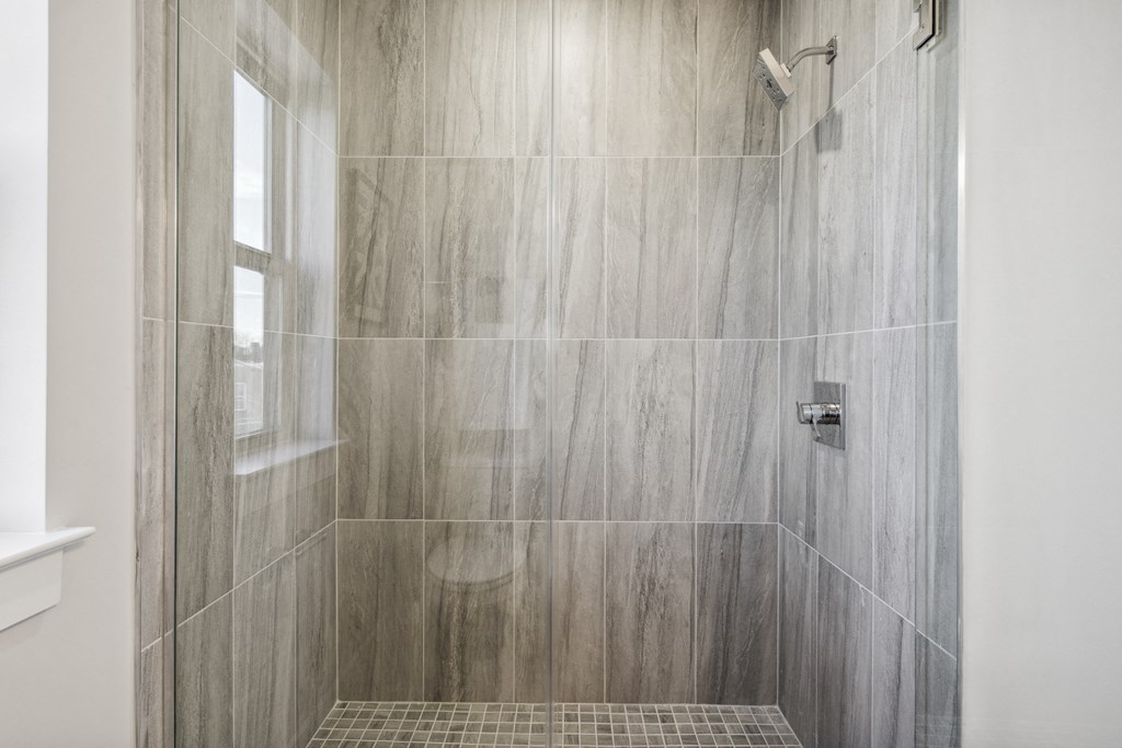 an image of a shower in a tiled bathroom
