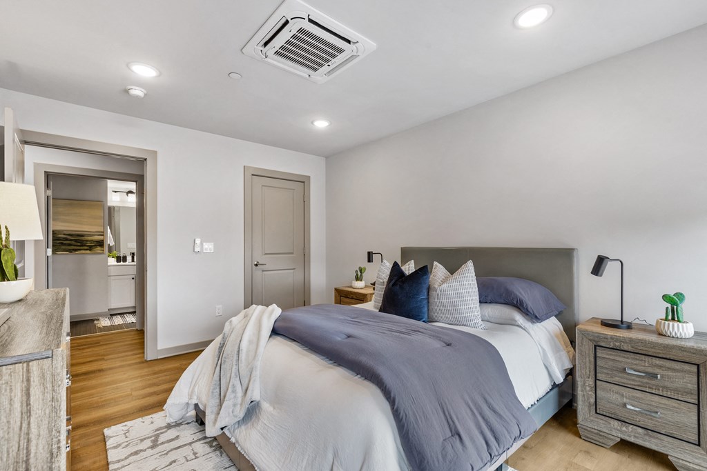 a bedroom with a large bed and a closet