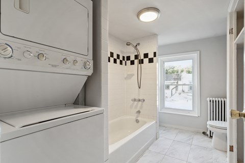 a laundry room with a washer and dryer