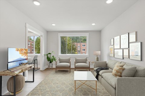 a living room with a couch and a tv