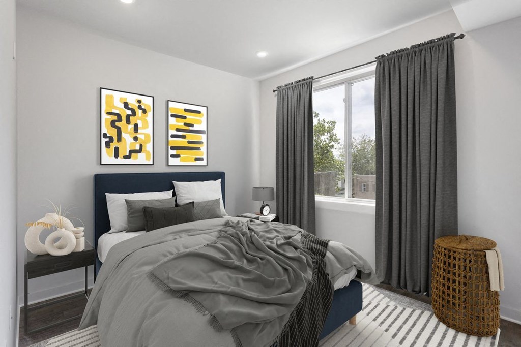 a bedroom with a bed and a window