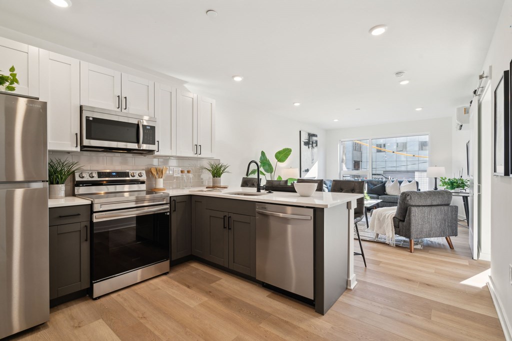 Kitchen with stainless steel appliances and a counter top Kitchen with stainless steel appliances and a counter top at The Isaac, Philadelphia, PA, 19122
