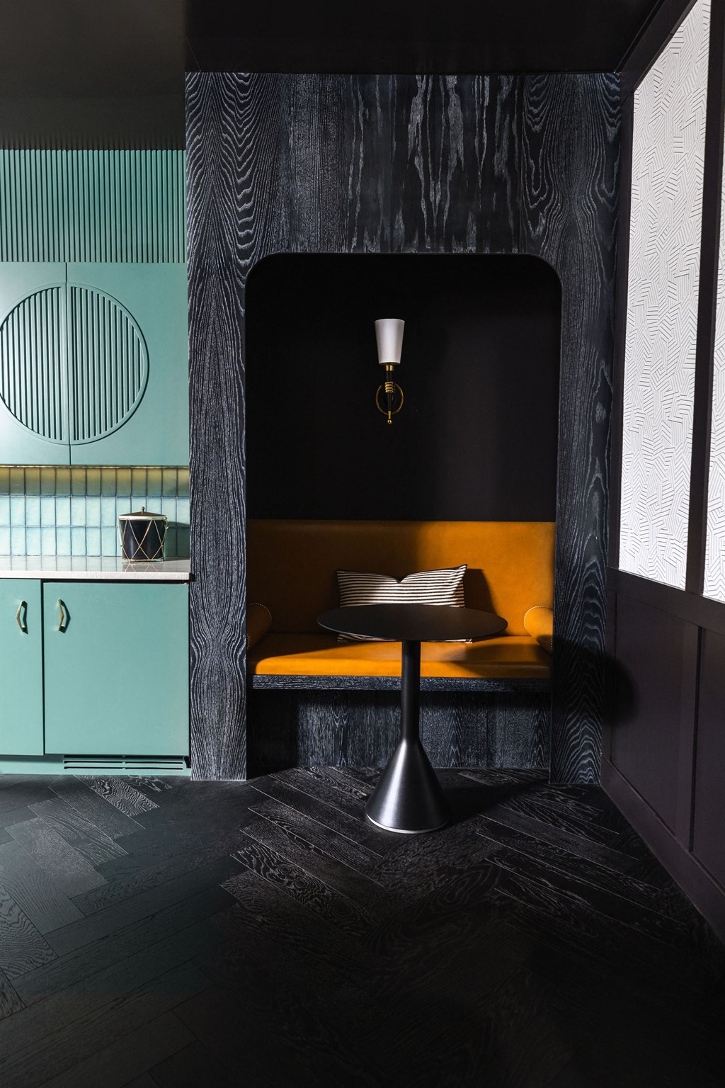 a small table with a book on it in a room with a blue and yellow