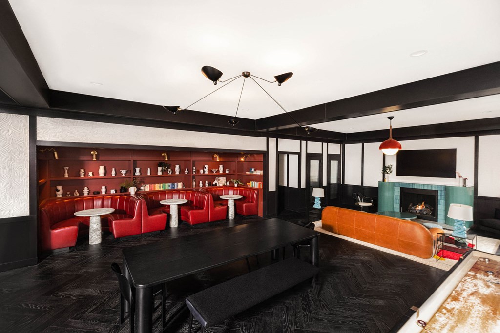 a living room with a couch and a table and a fireplace