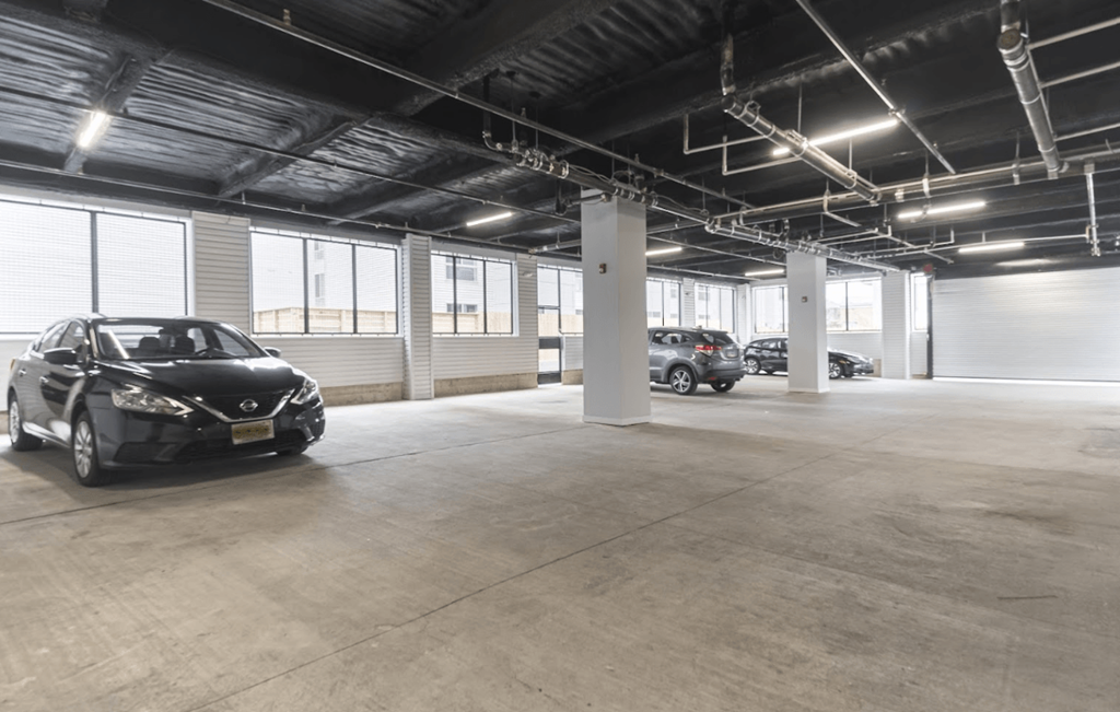 an empty parking lot with cars parked in it