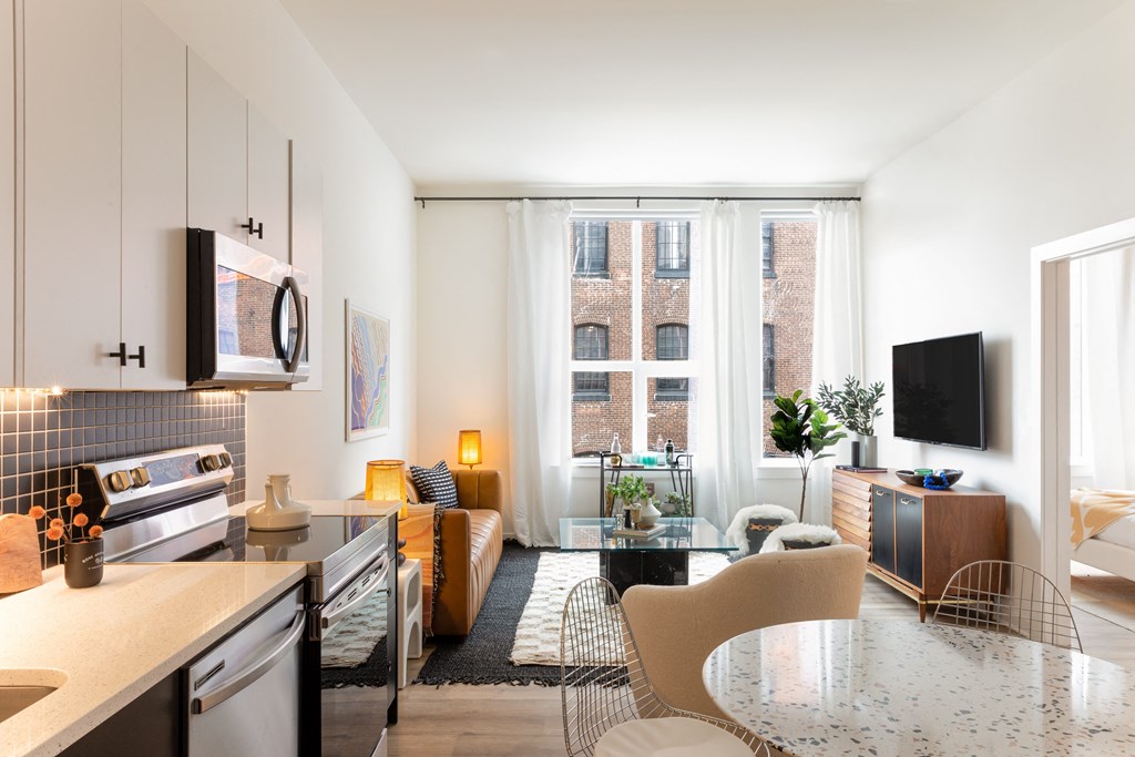 a kitchen and living room in a 555 waverly unit