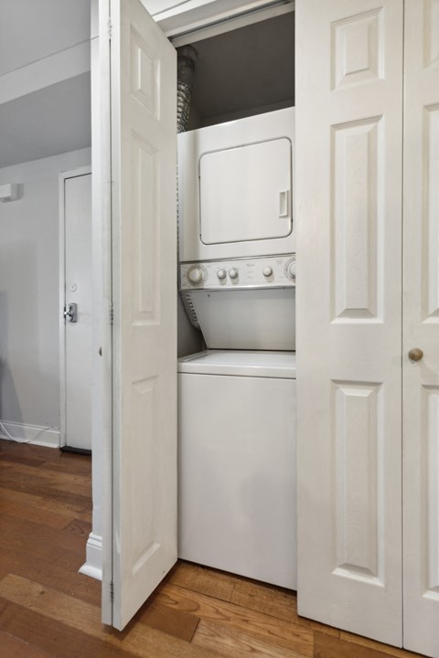 a small laundry room with a washer and dryer