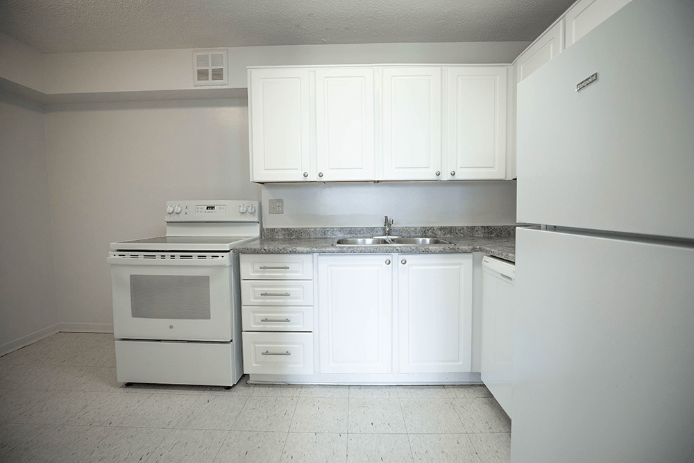Kitchen with White Cabinets and White Appliances