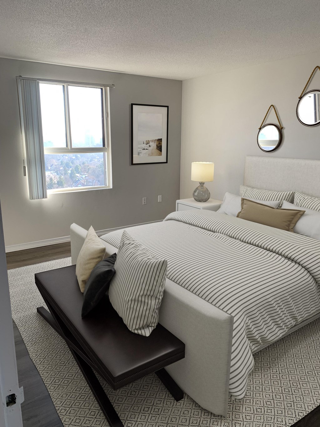 a bedroom with a large bed and a window