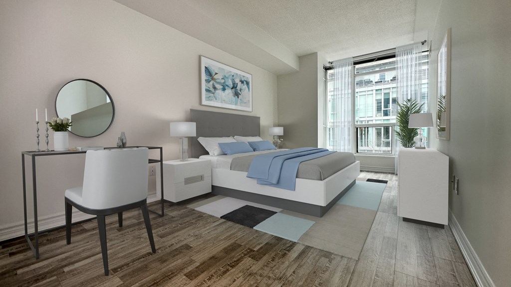 a bedroom with a bed and a large window