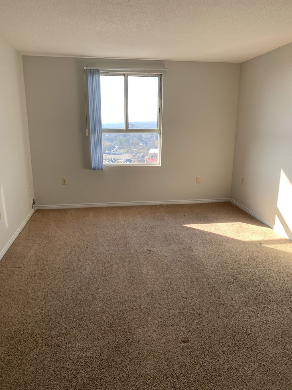 an empty room with a window in it
