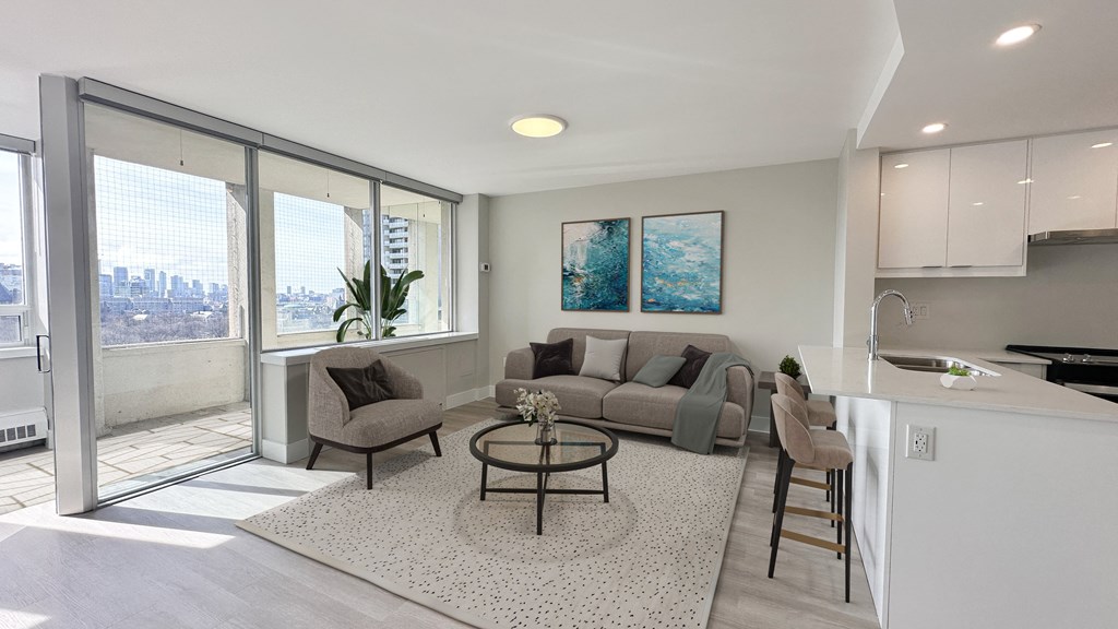 Living Space with view of balcony and open concept kitchen
