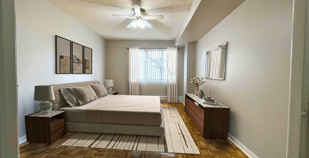 a bedroom with a bed and a ceiling fan