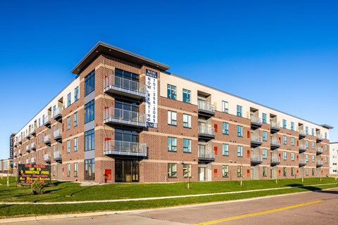 A large apartment building with a sign that says "BROOKLYN".