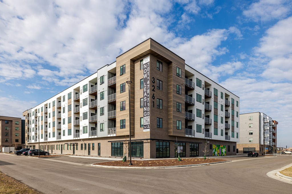A large apartment building with the number 3 on the front.