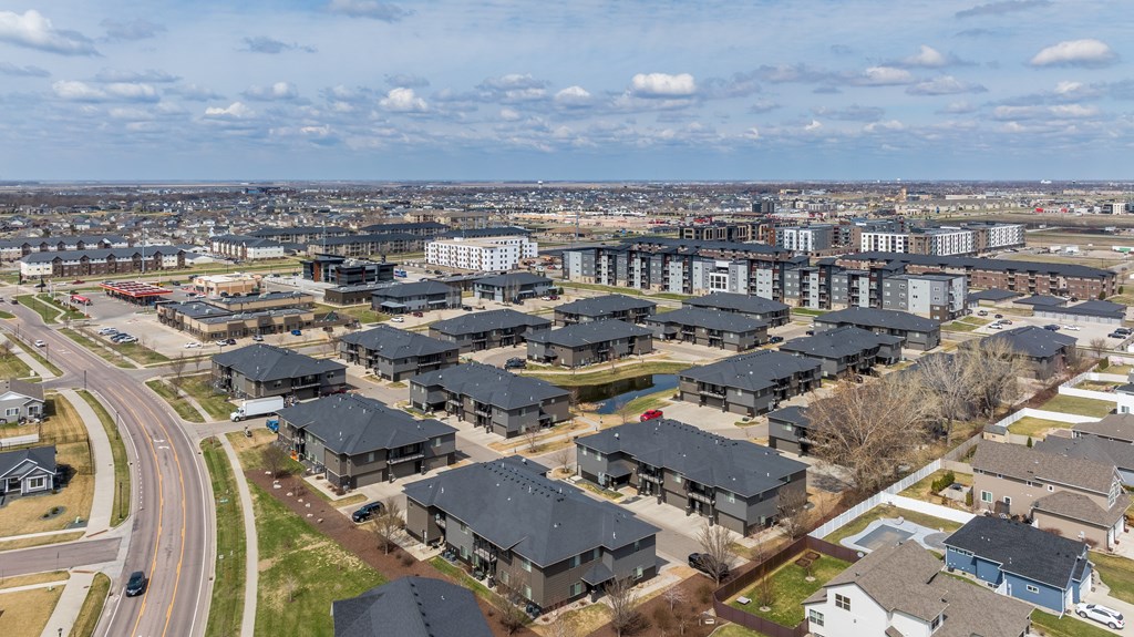 A suburban neighborhood with houses and apartment buildings.