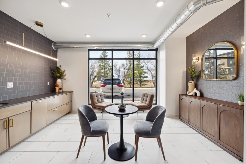 A lounge area with table and chairs.