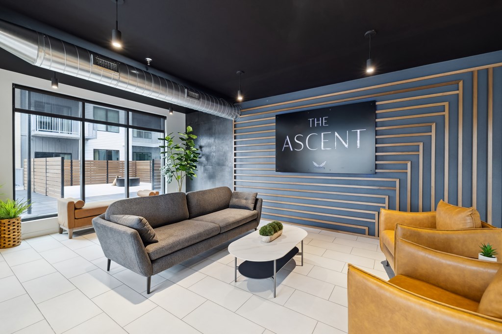 A sofa with a sign that says The Ascent