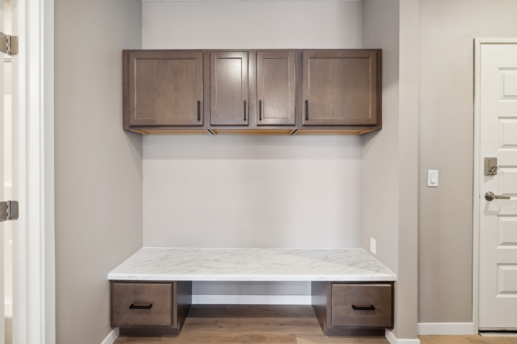 A boot bench with cabinets above.