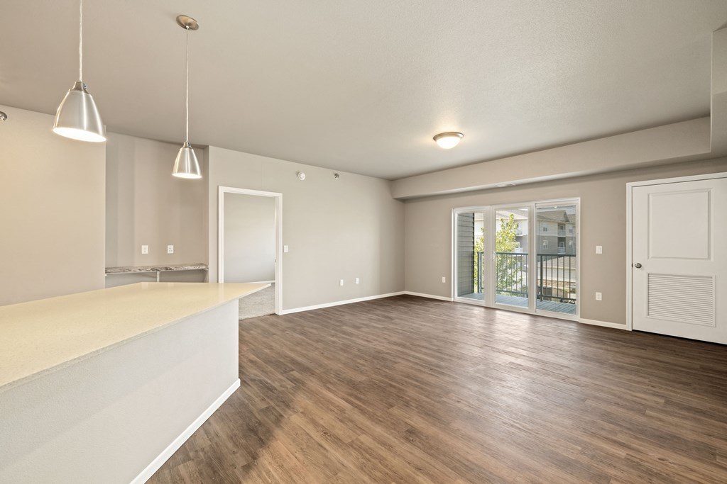 A room with wooden floors and white walls.