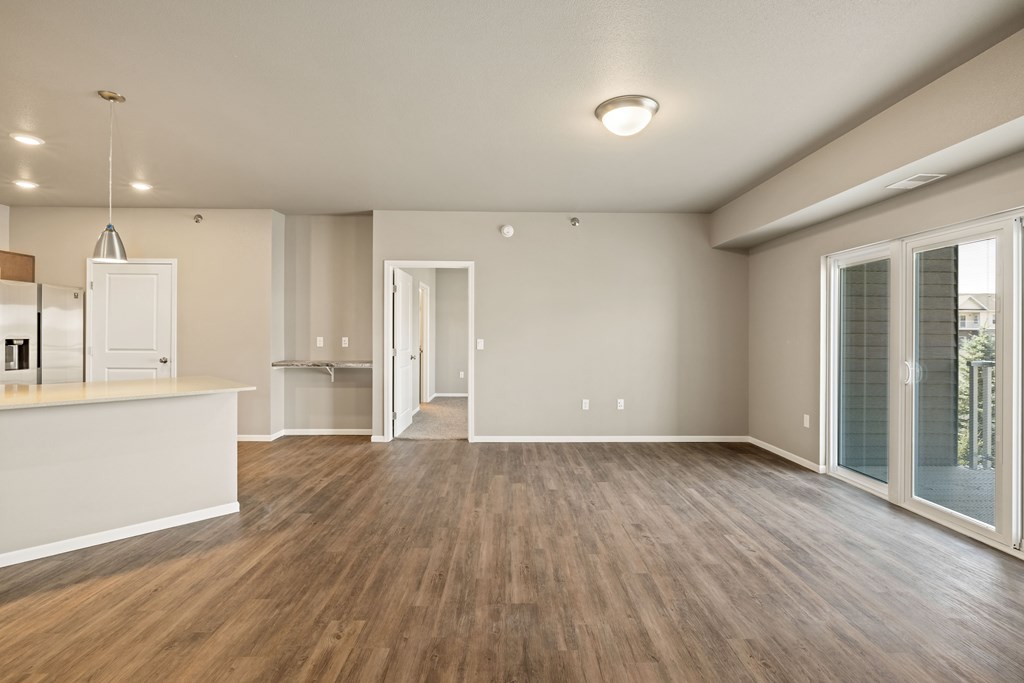 A room with wooden floors and white walls.