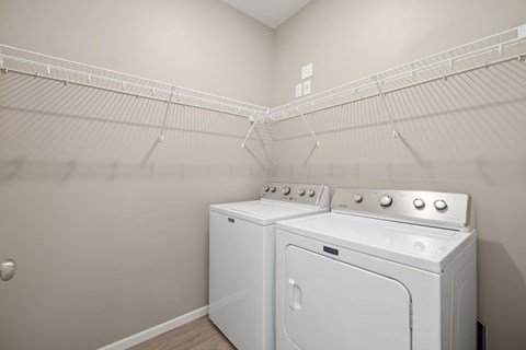 A laundry room with a washer and dryer.